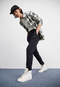 Nike Sportswear Tracksuit bottoms - black