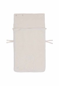 Beige fleecedeken met een zachte textuur, met een gestikt konijnen gezicht ontwerp. Het heeft een omgevouwen bovenkant met drukknoopsluitingen en strikken.