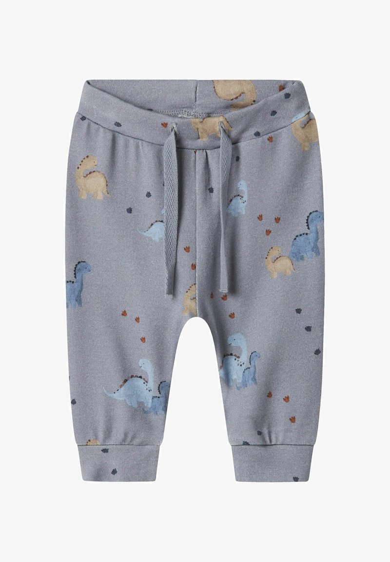 Graue Baumwoll-Jogginghosen mit elastischem Bund, die mit bunten Dinosauriermustern und kleinen Herzmotiven versehen sind. Enganliegende Bündchen an den Knöcheln.