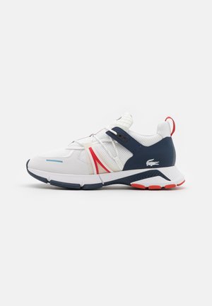 White athletic sneaker with navy and red accents, mesh upper, elastic laces, and a textured sole with a small crocodile logo on the heel.