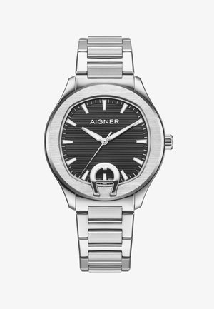 Reloj de pulsera Aigner de metal plateado con esfera texturizada negra, marcadores de hora plateados, tres agujas y distintivo emblema de herradura en la parte inferior.