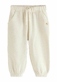 Krém színű, pettyes gyermeknadrág, rugalmas derékkal, húzózsinórral, oldalsó zsebekkel és rugalmas bokákkal.