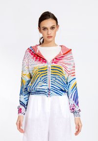 Colorful zip-up hoodie featuring a vibrant striped pattern in blue, yellow, pink, and white. Soft texture with elastic cuffs and hem.