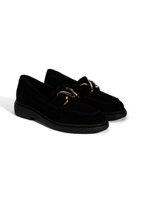 Black suede loafers with a rounded toe, featuring a decorative silver buckle and a textured black rubber sole.