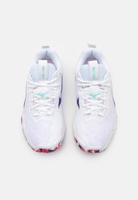 White athletic shoes with purple accents, textured upper, lace-up design, round toe, and colorful patterned outsole.