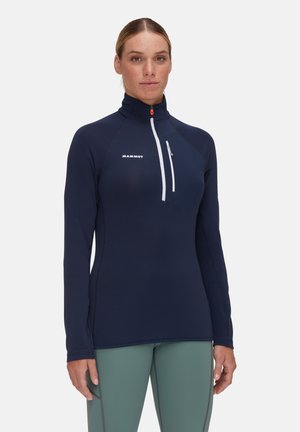 Maglietta a maniche lunghe blu navy con colletto a mezza cerniera, dotata di cerniera bianca, tessuto testurizzato e logo sul petto.