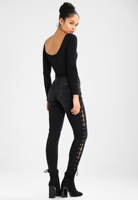 Urban Classics LACE UP PANTS - Oprijete (skinny) kavbojke - black washed