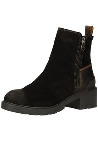 Black suede ankle boot with a rounded toe, side zipper, and brown leather accents. Features a block heel and contrasting white stitching.
