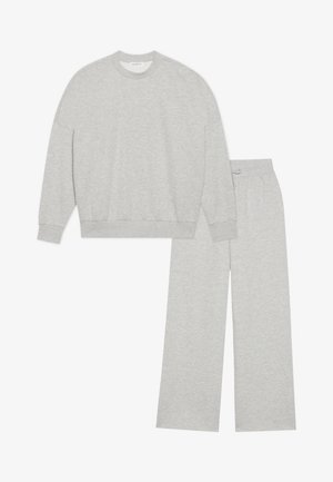 Gray cotton sweat set featuring a crew neck sweatshirt with ribbed cuffs and matching wide-leg pants with an elastic waistband.