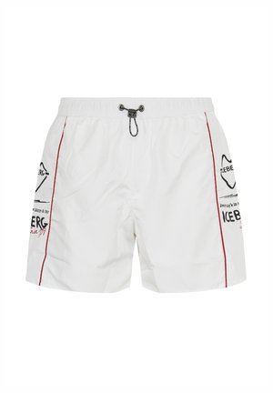 White swim shorts with black and red logo prints on sides, red piping along seams, and black adjustable drawstring waist.