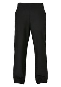 Svart joggebukse med ribbestruktur, med elastisk midje, smalere ben og uten synlige logoer eller mønstre.