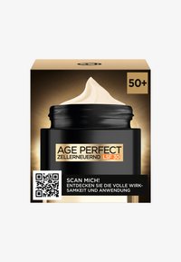 Svart burk med ett krämfärgat lock, märkt med "AGE PERFECT" i vitt och orange. Förpackningen har en QR-kod och information om SPF 30.