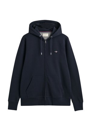 Marineblauer Zip-Hoodie mit Kordelzugkapuze, Fronttaschen, gerippten Bündchen und Saum, featuring ein kleines gesticktes Logo auf der Brust.