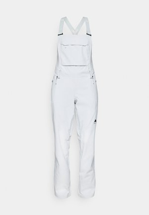 White ski overalls with adjustable straps and a front zip pocket. Features side zippers and a triangular logo on the lower leg. Smooth fabric.