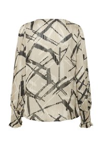 Langsleeve blouse in beige en zwart met een geometrisch patroon. Beschikt over plooien en smockmanchetten, gemaakt van lichte, gestructureerde stof.