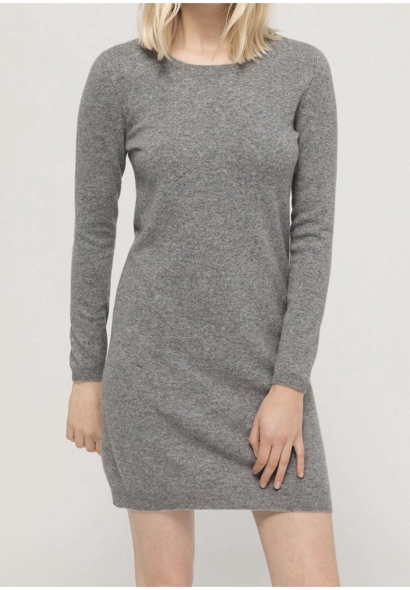 Gray long-sleeve dress made of a soft, textured fabric. Features a round neckline and a fitted silhouette with a slightly gathered waist.