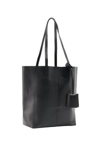 Sac en cuir noir avec deux longues poignées, une texture lisse, des détails de coutures verticales et une petite poche attachée pour un rangement sécurisé.
