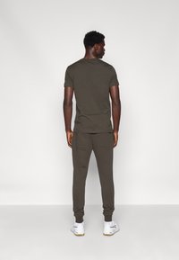 Björn Borg CENTRE TAPERED PANTS - Donji dijelovi trenirke - peat