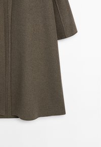 Olive green wool blend coat with wide sleeves, a straight silhouette, and subtle texture; features concealed front closure and no visible hardware.