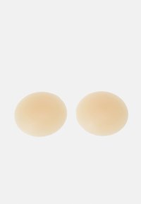 Beige silicone bra inserts, oval shape, smooth texture, soft finish. Two pieces shown against a plain white background.