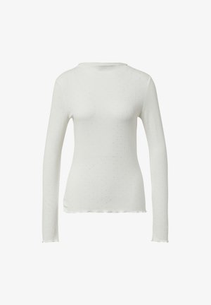 Weißes Langarmoberteil aus geripptem Material mit Punktmuster. Hat einen runden Ausschnitt und einen gewellten Saum. Weicher, dehnbarer Stoff.