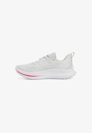 White athletic shoe with a textured upper, lace-up design, and pink accent stripe on the midsole. Features a cushioned sole and fabric loop.