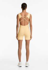 OYSHO EVERMOVE SHORT - Jumpsuit - yellow