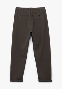 Donkerbruine, gestructureerde broeken met een elastische tailleband en twee achterzakken, met een taps toelopend ontwerp en een nette afwerking van de zoom.