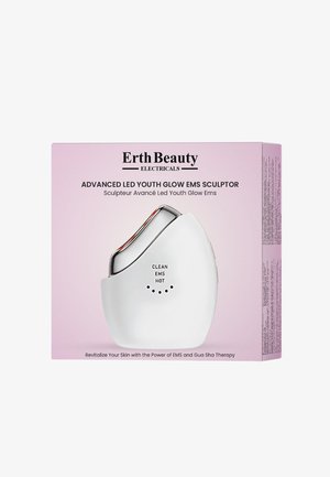 Biały ergonomiczny urządzenie z metalowym wykończeniem, wyposażone w przyciski oznaczone "CZYSTE", "EMS" i "GORĄCE" oraz lampki wskaźnikowe, na różowym pudełku.