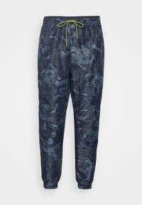Puma STAPLE PANTS - Træningsbukser - black