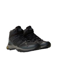 Buty trekkingowe w kolorze czarnym i szarym, z siateczkową cholewką, systemem sznurowania, wzmocnionym czubkiem oraz podeszwą Vibram zapewniającą przyczepność i trwałość.