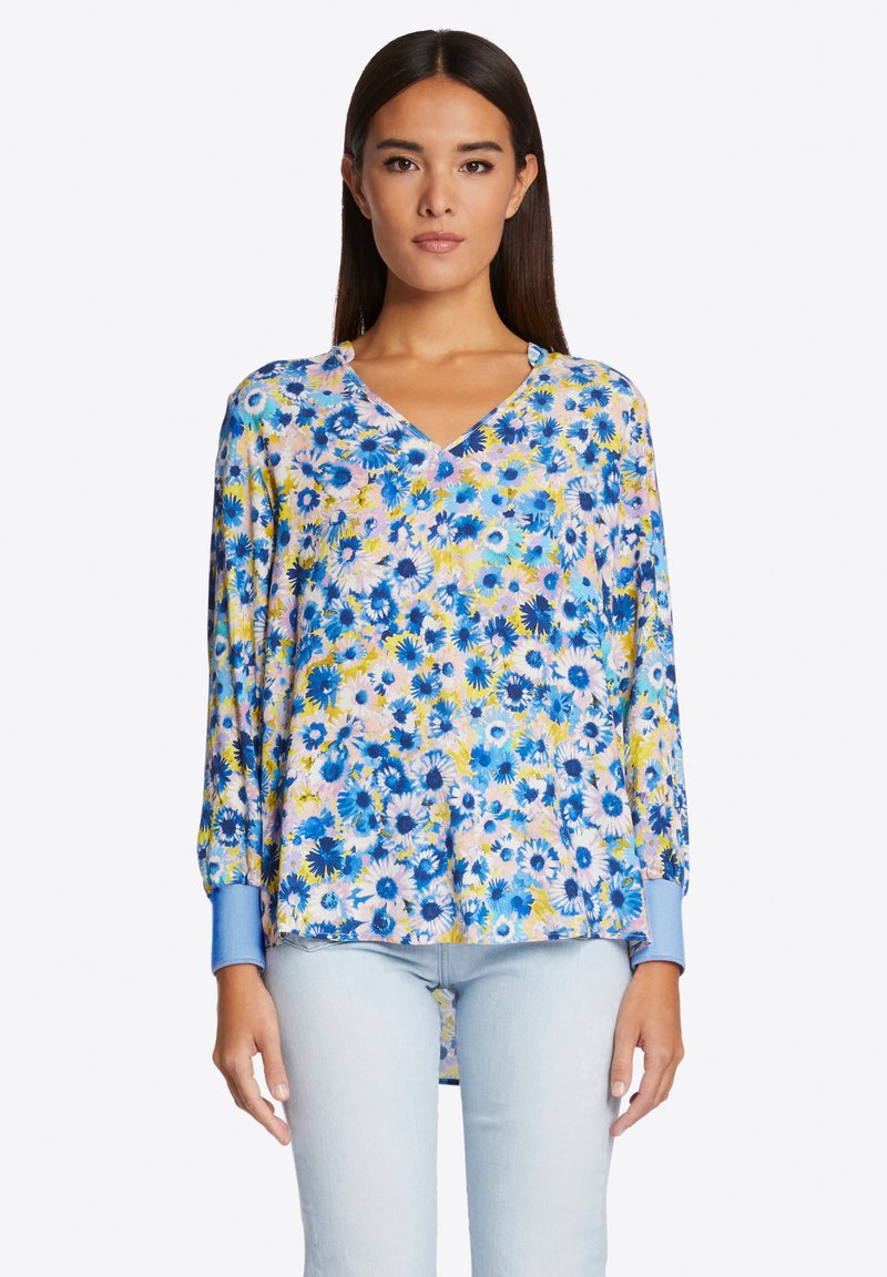 Bloem blouse met V-hals, lange mouwen, blauwe en pastelpatronen en met manchetten, gemaakt van lichtgewicht materiaal.