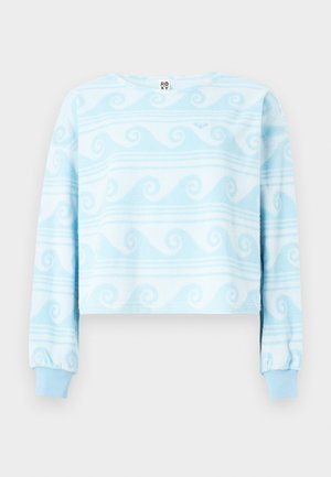 Hellblaues und weißes, langärmliges, kurzes Sweatshirt mit Wellenmustern und gerippten Bündchen.