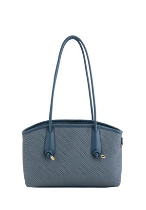 Bolso azul texturizado con dos asas largas y nudos con puntas doradas, de forma rectangular con un borde superior ligeramente curvado.