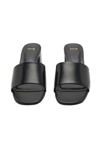 Black slide sandals featuring a wide top strap and open toe design, made from smooth synthetic material with a flat sole.