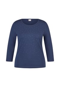 Marineblaues Langarmoberteil mit Rundhalsausschnitt und verstreuten silbernen Verzierungen auf der Vorderseite. Hergestellt aus glattem, baumwollreichen Stoff.