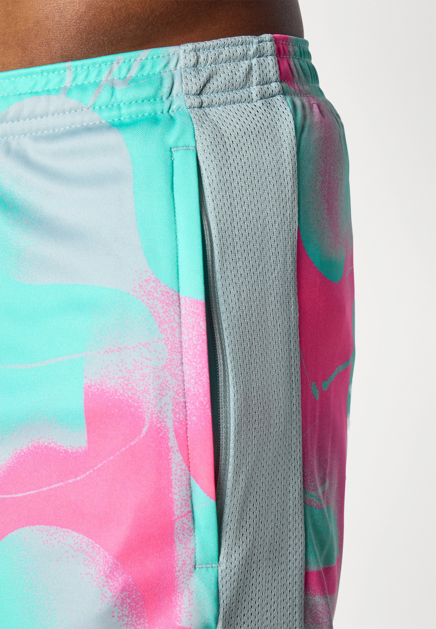 green and pink nike shorts