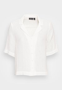 Camicia in lino bianca a maniche corte con colletto a rever, chiusura frontale con bottoni e polsini arrotolati. Tessuto leggero con vestibilità rilassata.