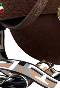 Brown leather round handbag with a structured design, featuring a decorative gold clasp and a patterned strap in browns, blacks, and whites.