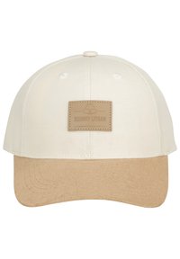 Fehér vászon testű sapka bézs bőr szélekkel. Elöl, egy téglalap alakú barna bőrcímke van, amelyen a márka neve van gravírozva.