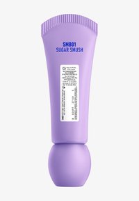 Lila tryckflaska med rund botten, med fet text "SMB01 SUGAR SMUSH" och en blank etikett med produktinformation.