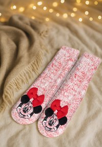 Calzini a righe rosse e bianche con un design di Minnie Mouse ricamato e fiocchi 3D rossi e neri. Materiale morbido e soffice.