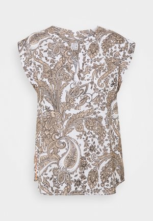 Blouse blanche sans manches avec des motifs paisley et floraux complexes beige et marron, encolure ronde et petites fentes latérales.