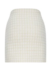 Mini-jupe texturée couleur crème avec un motif géométrique subtil et une silhouette droite.