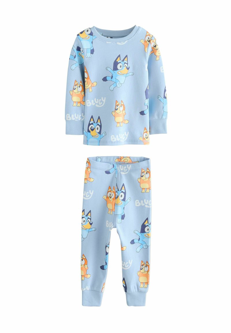 Set di pigiama azzurro chiaro composto da maglia a maniche lunghe e pantaloni, con personaggi di cani cartoon colorati e testo "Bluey" in tutto il set. Tessuto morbido.