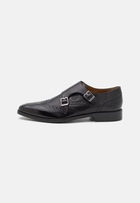 Black leather dress shoe with perforated details, double buckle closure, pointed toe, and low profile heel. Smooth texture enhances design.