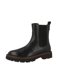Botín Chelsea de cuero negro con suela gruesa, panel lateral elástico y lengüeta en la parte posterior.