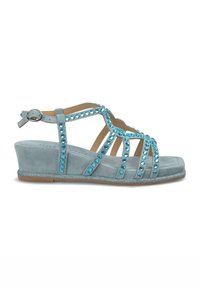 Sandali a zeppa blu chiaro con texture in suede, decorati con strass color acquamarina e suola glitterata. Presentano una cintura alla caviglia regolabile.