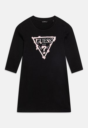 Schwarzes langärmliges Kleid mit pink-weißem, blumigem Guess-Logo in einem Dreieck auf der Brust, keine weiteren sichtbaren Designs oder Merkmale.