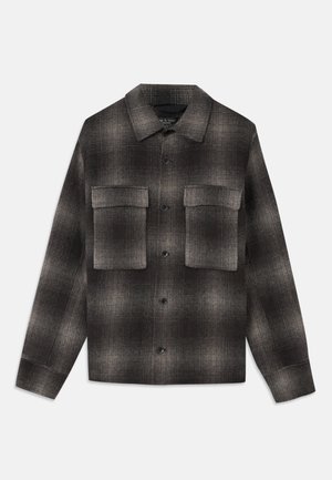 Dark gray and black plaid button-up jacket with pointed collar and two large flap pockets on chest, long sleeves, and straight hem.